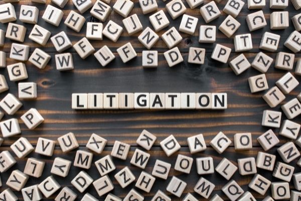 blocks with letters on them that spell 'litigation'